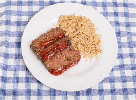 Meatloaf and Brown Rice on White Plate — Stock Photo © dbvirago #69896075