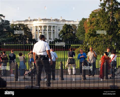 United States Secret Service Uniformed Division Police Department officer watches crowds outside ...