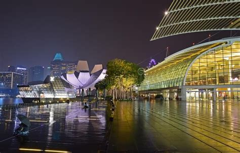 the city is lit up at night and it's lights shine brightly on the buildings