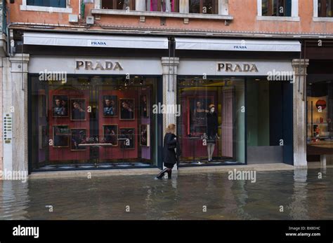 Prada exterior during high tide floods San Marco district Venice the Veneto northern Italy ...