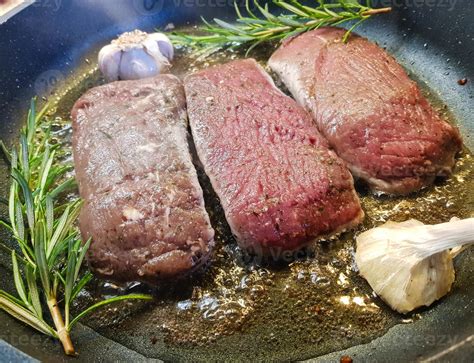 Rosemary lamb steaks with garlic 3008111 Stock Photo at Vecteezy