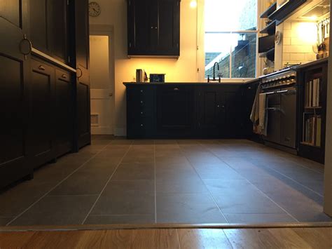 Vinyl floor in a kitchen grey stone effect | Luxury vinyl tile, Grey ...