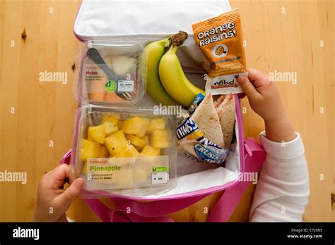 A children's lunch box filled with pre-packed fruit portions Stock Photo: 38772165 - Alamy