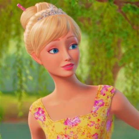 a barbie doll wearing a yellow dress with a tiara on it's head