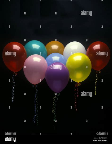 GROUP OF PARTY BALLOONS ON BLACK BACKGROUND Stock Photo - Alamy