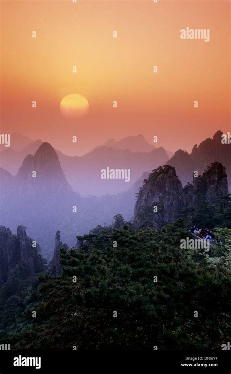 Sunrise, Chinese people, tourists are watching the sunrise. Huangshan mountains. China Stock ...