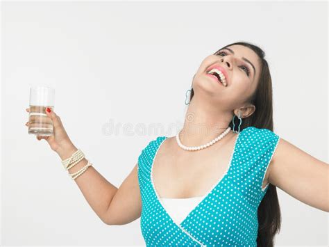 Woman Drinking a Glass of Water Stock Photo - Image of dress, drinking: 6910782