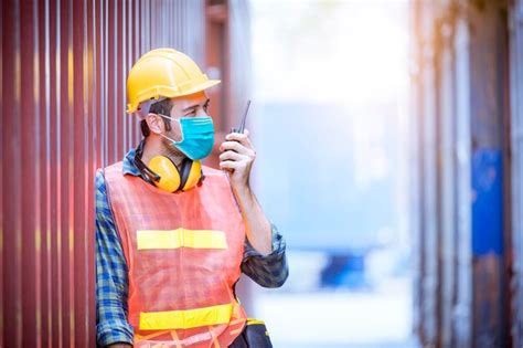 Premium Photo | Portrait team dock workers posing under working and ...