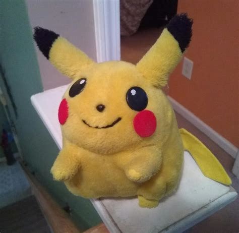 A well-loved Pikachu bootleg plush me and my younger sister have owned ...