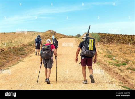 Pilgrims walking the Camino de Santiago pilgrimage route, the way of St ...