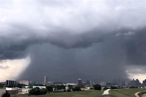 Terrifying video shows a biblical microburst 'rain bomb' descending on Texas dwarfing the city below