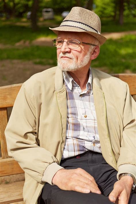 Old Man Sitting On Park Bench Stock Photo - Image: 46579764