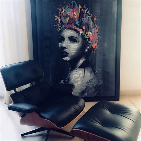 an image of a woman with a crown on her head sitting in front of a painting