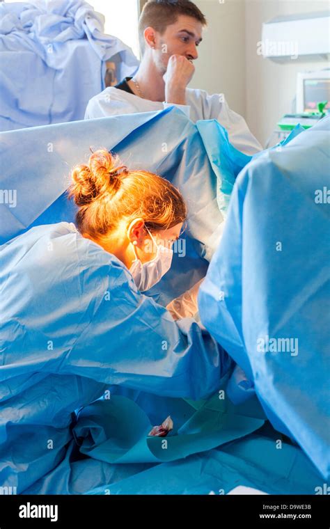 Suturing episiotomy performed by a midwife. Obstetrics and gynaecology department, Limoges ...