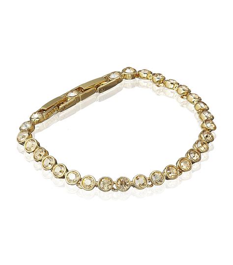 Swarovski Golden Shadow Tennis Bracelet in Gold | Lyst