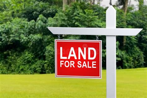 LAND for SALE SIGN on Empty Meadow - Real Estate Conceptual Image ...