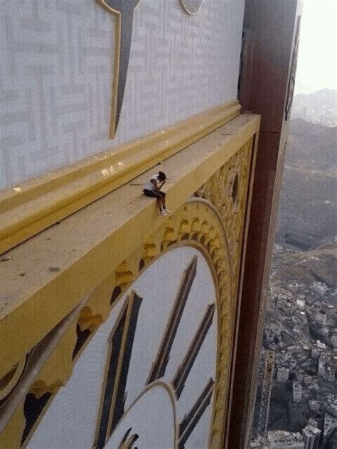 A person sitting on a giant clock tower. : r/megalophobia