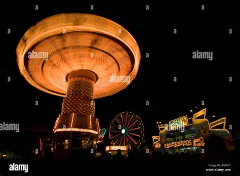 Carnival rides at night Stock Photo - Alamy