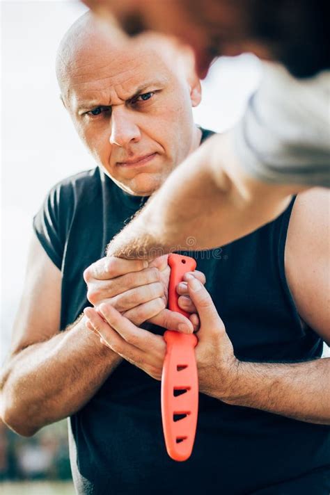 Self Defense Disarming Technique Against Threat and Knife Attack Stock Photo - Image of defense ...