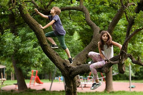 "Children Playing In The Park." by Stocksy Contributor "Mosuno" - Stocksy