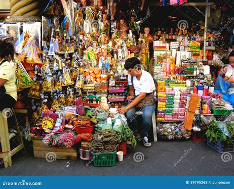 Asian Street Vendor Selling Different Religious Items Outside Of Quiapo ...