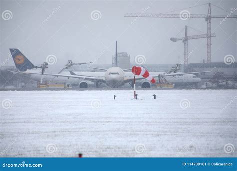 Planes Moving in Munich Airport, Winter Time with Snow Editorial Photo - Image of munchen ...