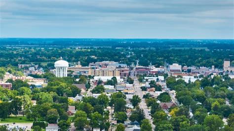 Premium Photo | Muncie indiana aerial of city with downtown buildings and water tower on ...