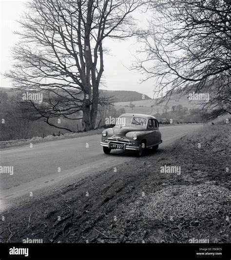 1950s historical picture of a Standard Vanguard car parked on the side ...