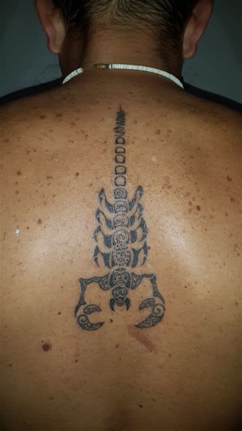 Scorpion tattoo done freehand with bamboo with my birth year in thai numerals and good luck sign ...