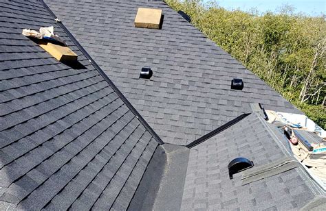 Asphalt shingle with dead valley and barrel roofs