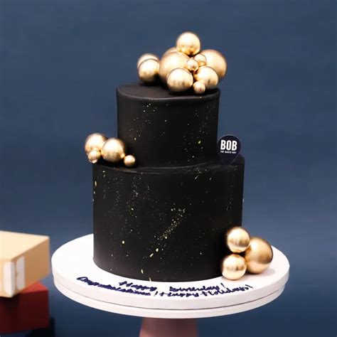 Classic Black And Gold Cake With Gold Ornaments