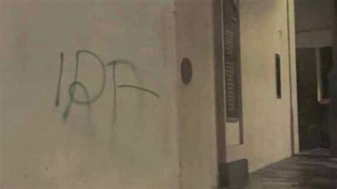 Man arrested after 'IRA' is sprayed onto wall of building where ...