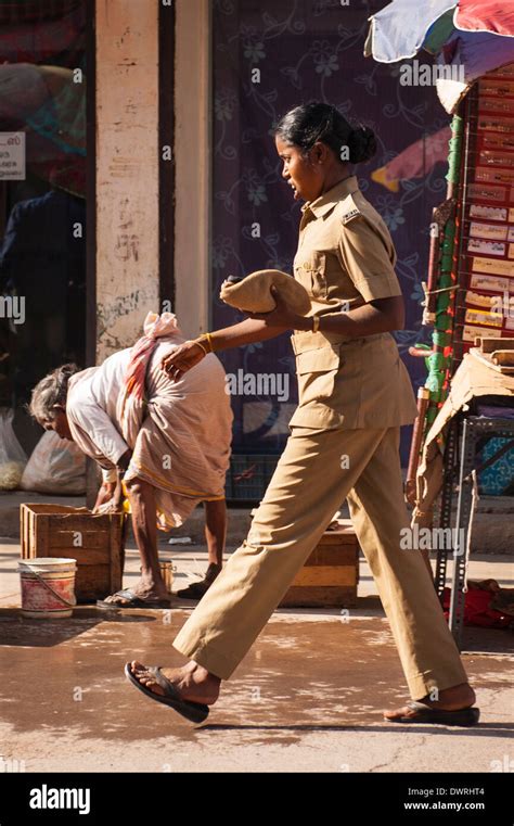 South Southern India Tamil Nadu Madurai street scene pretty young lady female policewoman police ...