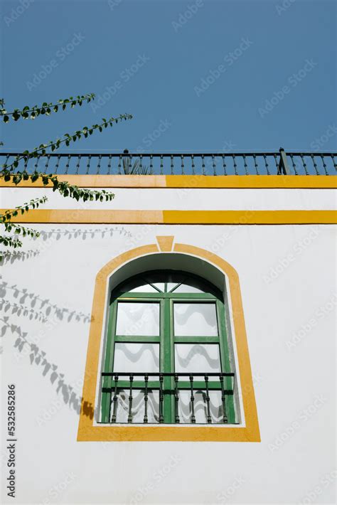 Window of colonial building with arched windows Stock Photo | Adobe Stock