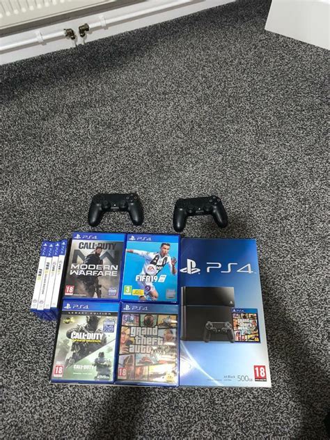 PS4 + 2 controllers + games | in Dunmurry, Belfast | Gumtree