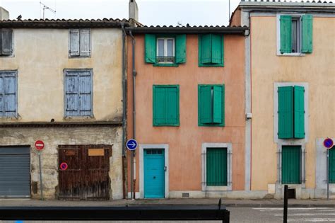 Premium Photo | Colorful houses with green shutters