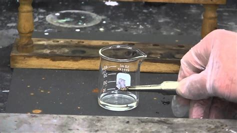 Potassium metal reacts with concentrated nitric acid - YouTube