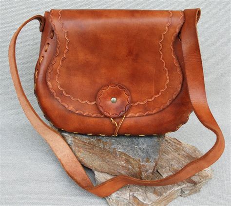 Vintage 1970s Hand-tooled Leather Shoulder Bag. $48.00, via Etsy. | Hand tooled leather