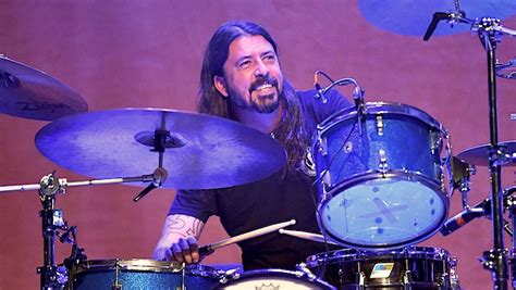 Dave Grohl Explains Why It's 'Practically Impossible' To Drum And Sing