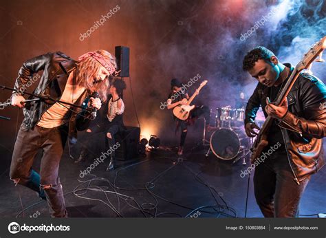 Rock band on stage — Stock Photo © TarasMalyarevich #150803854