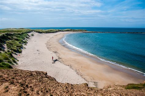 A small sandy beach - Holy Island of Lindisfarne, Northumberland ...