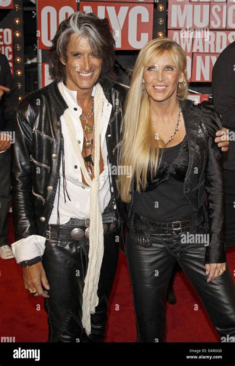 Joe Perry (L), guitarist of US rock band Aerosmith, and his wife Billie ...