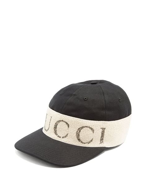 Click here to buy Gucci Logo-print headband-detail cotton cap at ...