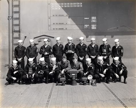 [Photo] The USS Intrepid photographic unit posing for a photograph with some of their equipment ...