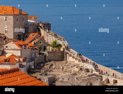 DUBROVNIK, CROATIA, EUROPE - Tourists walk the wall in fortress city of ...