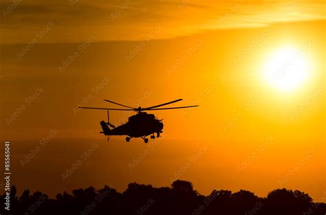 silhouette of military helicopter at sunset Stock Photo | Adobe Stock