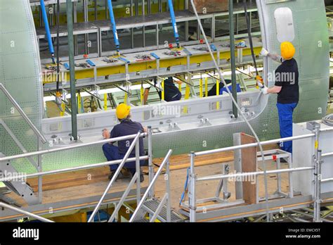 Airplane construction in a hangar Stock Photo - Alamy