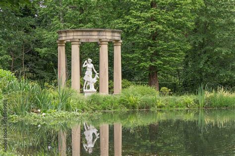 Beautiful scenery of the statue of Goddess Diana in a stone temple near a pond Stock Photo ...