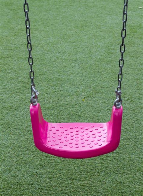 Pink Swing in Playground. stock photo. Image of recreation - 36514964