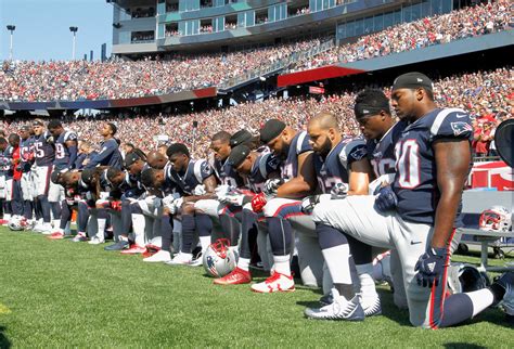 PHOTOS: NFL Players kneel in protest during the National Anthem